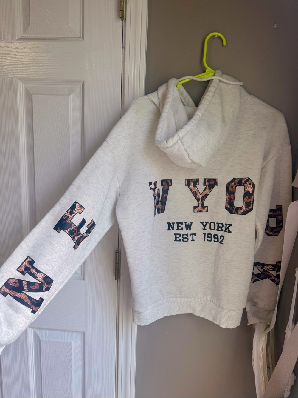 Grey leopard print hoodie with cute design on the sleeves and the back